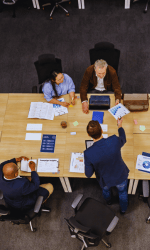 Group of coworkers sitting around a table